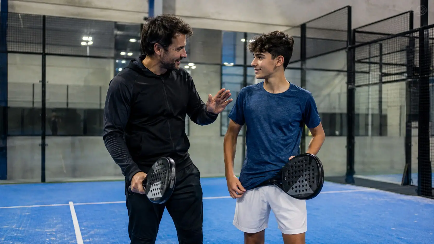 Coach talking a player through the next drill